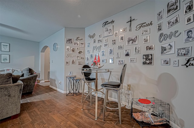 2827 Silver Charm, Houston, TX 77014 - dining space with arched walkways, wood finished floors, and baseboards