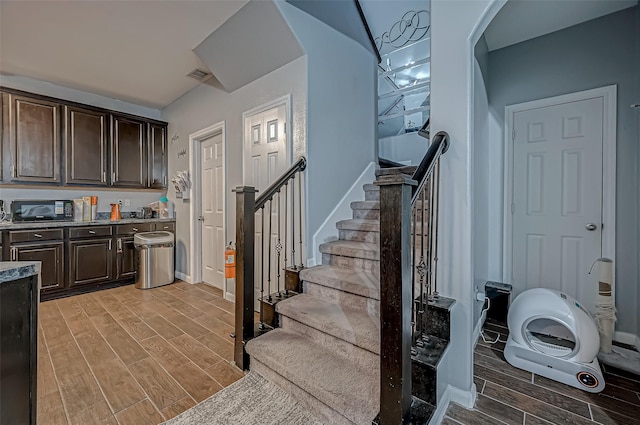 2827 Silver Charm, Houston, TX 77014 - stairs featuring wood finished floors and baseboards