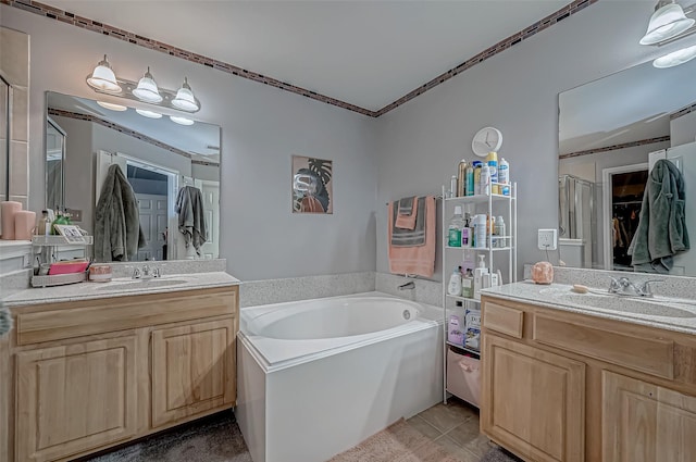2827 Silver Charm, Houston, TX 77014 - full bathroom with a shower stall, a bath, two vanities, and tile patterned flooring