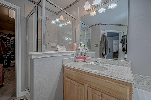 2827 Silver Charm, Houston, TX 77014 - full bathroom with a stall shower, a walk in closet, and vanity