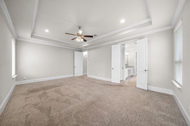 28911 Copper Break Ct, Katy, TX 77494 - empty room featuring a raised ceiling, ceiling fan, plenty of natural light, ornamental molding, and recessed lighting
