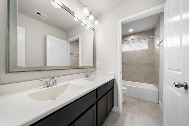28911 Copper Break Ct, Katy, TX 77494 - bathroom featuring toilet, double vanity, tile patterned floors, shower / washtub combination, and baseboards