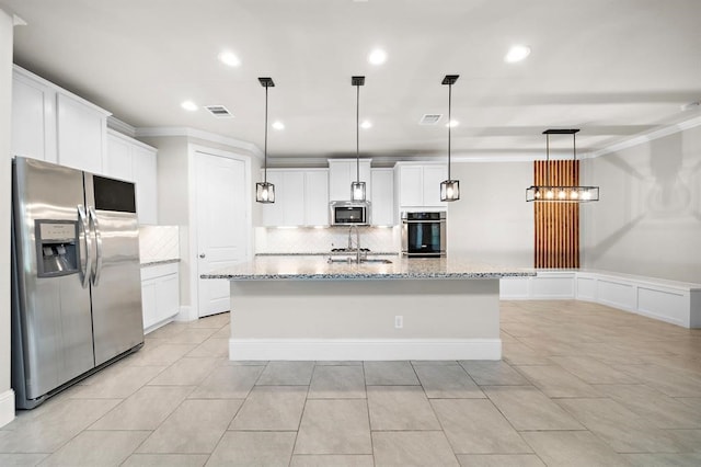 28911 Copper Break Ct, Katy, TX 77494 - kitchen featuring appliances with stainless steel finishes, backsplash, crown molding, light stone counters, and white cabinets