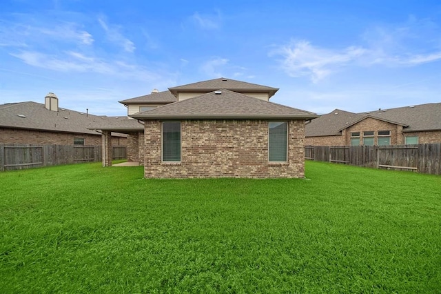 28911 Copper Break Ct, Katy, TX 77494 - back of house featuring a shingled roof and brick siding