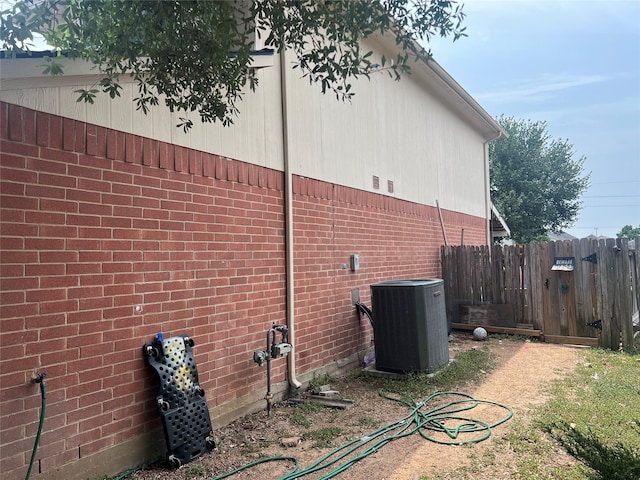 20347 Hunterclif Ln, Katy, TX 77449 - view of home's exterior with central AC and brick siding