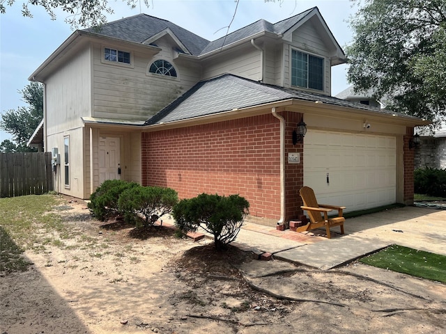 20347 Hunterclif Ln, Katy, TX 77449 - traditional-style home with brick siding, driveway, an attached garage, and roof with shingles