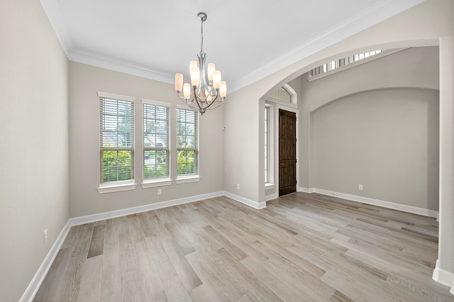 4021 Windsor Chase Dr, Spring, TX 77386 - empty room with arched walkways, a chandelier, crown molding, light wood finished floors, and baseboards