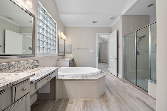 4021 Windsor Chase Dr, Spring, TX 77386 - bathroom with a stall shower, crown molding, a bath, two vanities, and wood finished floors