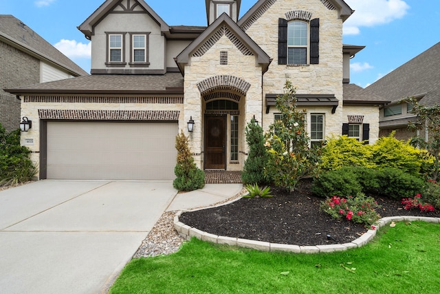 4021 Windsor Chase Dr, Spring, TX 77386 - view of front of home with stone siding, concrete driveway, roof with shingles, and an attached garage