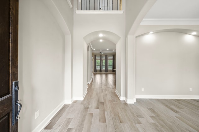 4021 Windsor Chase Dr, Spring, TX 77386 - foyer entrance featuring ceiling fan, light wood-style flooring, arched walkways, crown molding, and baseboards