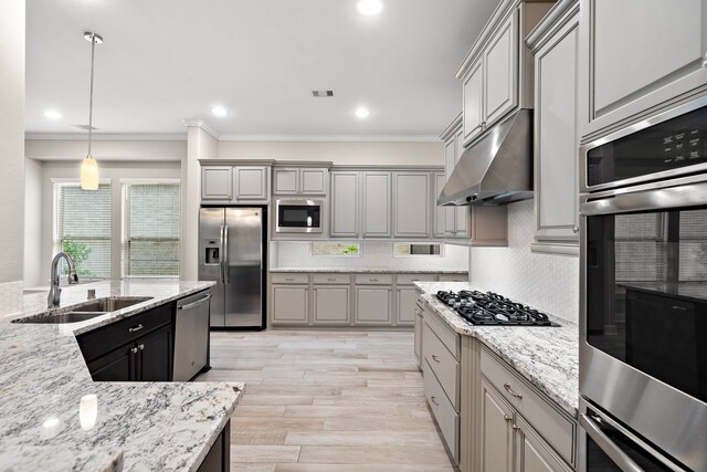 4021 Windsor Chase Dr, Spring, TX 77386 - kitchen featuring stainless steel appliances, a sink, under cabinet range hood, ornamental molding, and decorative backsplash