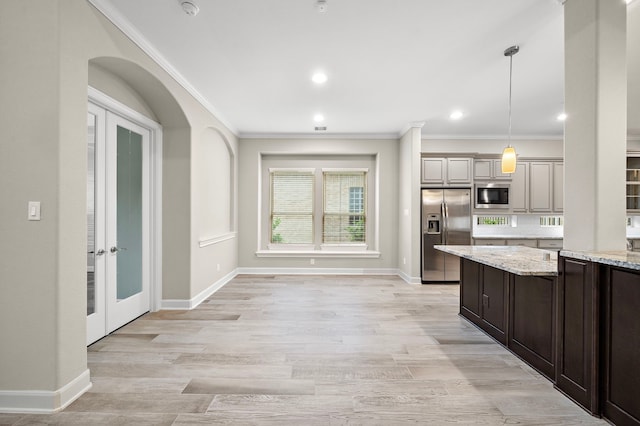 4021 Windsor Chase Dr, Spring, TX 77386 - kitchen featuring stainless steel appliances, crown molding, light stone countertops, baseboards, and recessed lighting