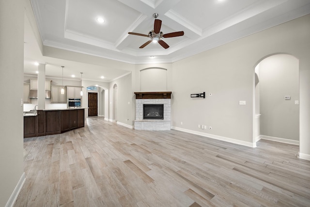 4021 Windsor Chase Dr, Spring, TX 77386 - unfurnished living room with a ceiling fan, a fireplace, crown molding, coffered ceiling, and beam ceiling