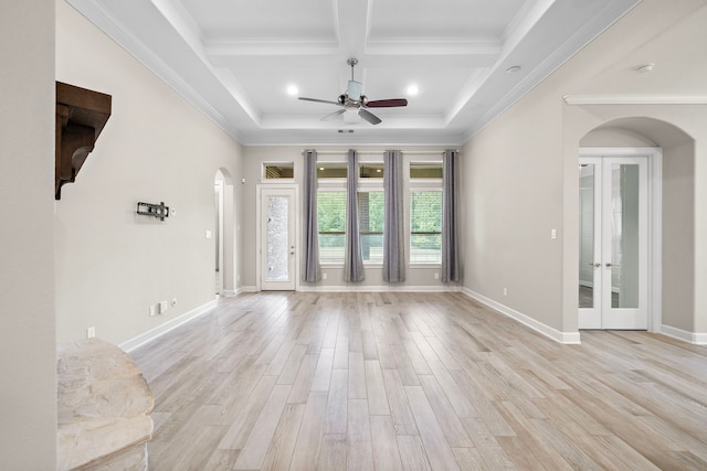 4021 Windsor Chase Dr, Spring, TX 77386 - unfurnished living room featuring arched walkways, a ceiling fan, coffered ceiling, french doors, and light wood-type flooring