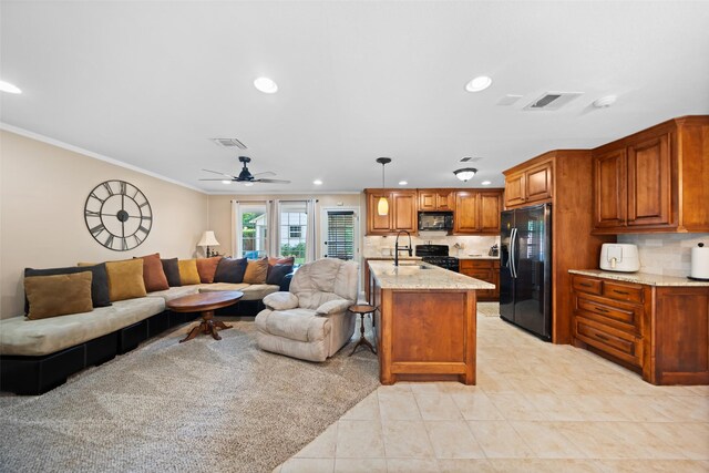 3431 Bristlecone Trl, Spring, TX 77380 - kitchen featuring black appliances, open floor plan, crown molding, brown cabinetry, and ceiling fan