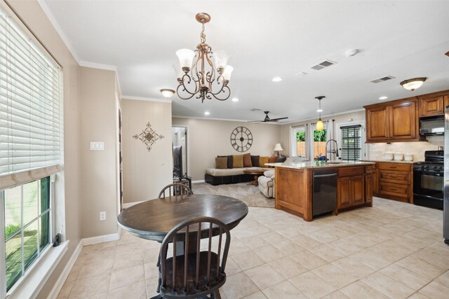 3431 Bristlecone Trl, Spring, TX 77380 - kitchen featuring black appliances, brown cabinets, crown molding, open floor plan, and a sink