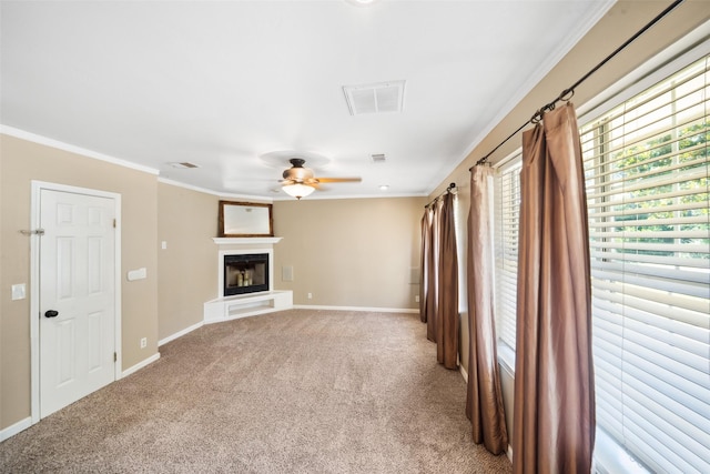 3431 Bristlecone Trl, Spring, TX 77380 - unfurnished living room with a ceiling fan, carpet, a glass covered fireplace, baseboards, and ornamental molding