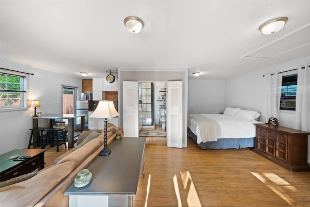3431 Bristlecone Trl, Spring, TX 77380 - bedroom featuring attic access and light wood finished floors