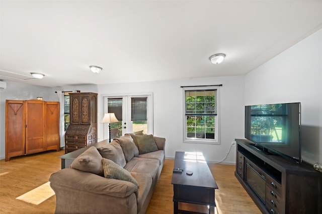 3431 Bristlecone Trl, Spring, TX 77380 - living room featuring french doors, light wood finished floors, and baseboards