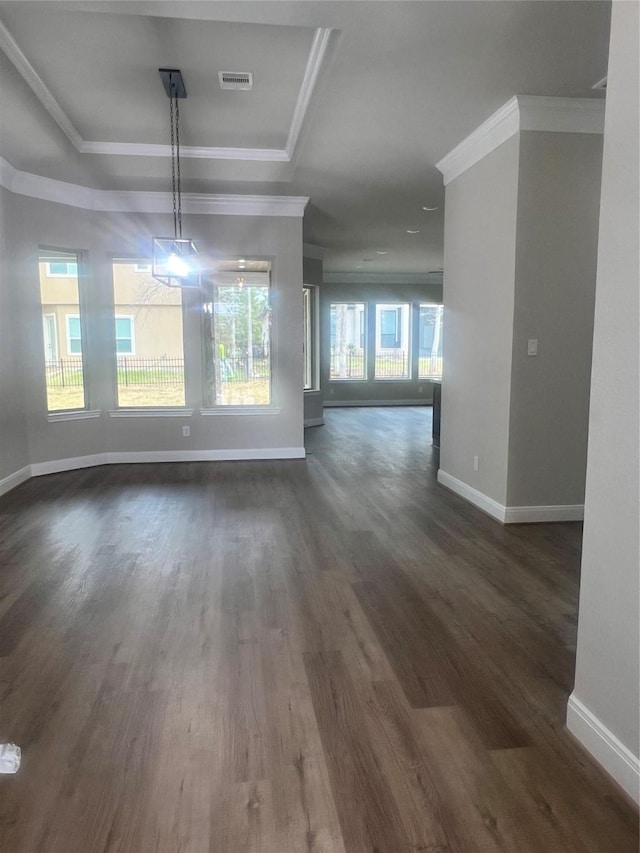 300 Camden Hills Dr, Montgomery, TX 77356 - unfurnished dining area with baseboards, ornamental molding, dark wood-type flooring, and a raised ceiling