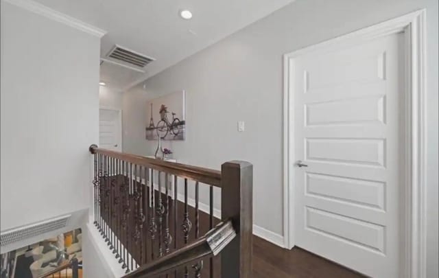 6617 Del Rio St Unit D, Houston, TX 77021 - hall featuring an upstairs landing, dark wood-style flooring, and recessed lighting