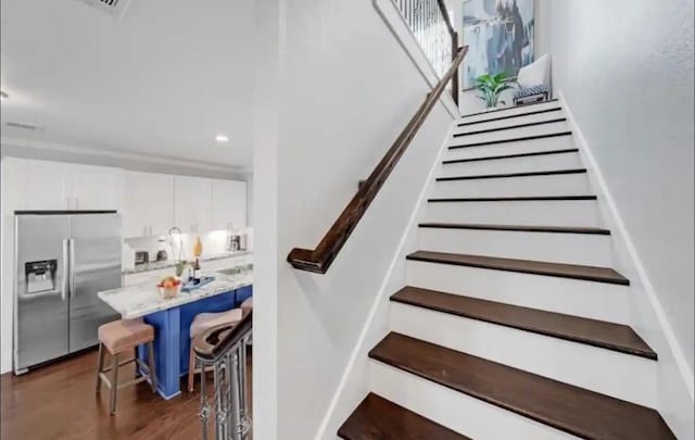6617 Del Rio St Unit D, Houston, TX 77021 - staircase featuring wood finished floors and recessed lighting