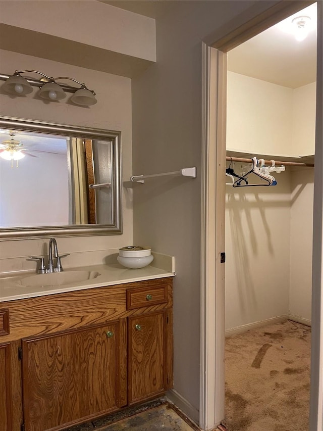 1501 N Park Side Dr, Deer Park, TX 77536 - bathroom featuring vanity, baseboards, and a ceiling fan