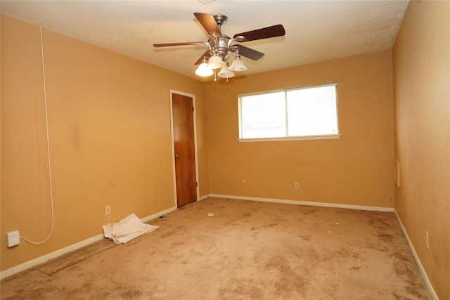 1501 N Park Side Dr, Deer Park, TX 77536 - empty room with carpet flooring, baseboards, and a ceiling fan