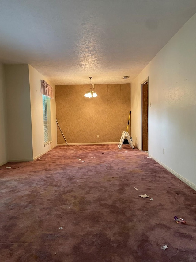 1501 N Park Side Dr, Deer Park, TX 77536 - unfurnished room featuring baseboards, carpet floors, and a chandelier