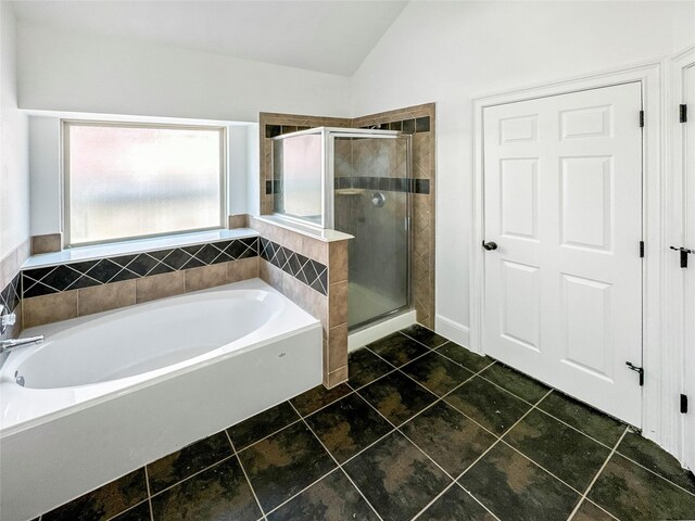 16019 Rustlers Trail Ln, Cypress, TX 77429 - full bathroom featuring a garden tub, a stall shower, and lofted ceiling
