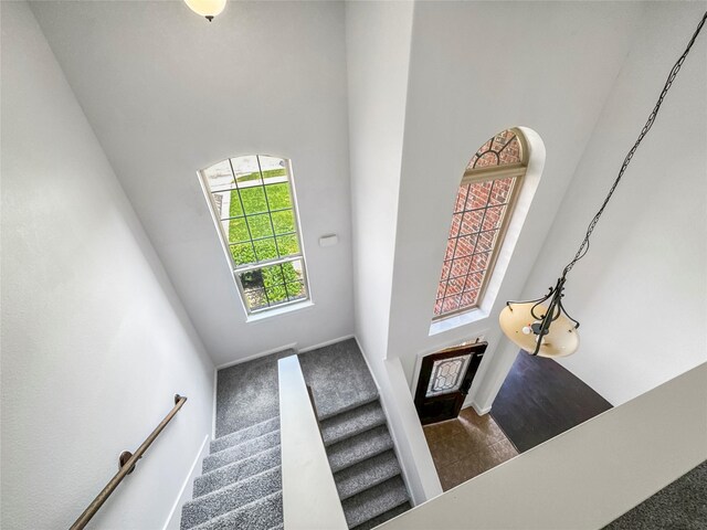 16019 Rustlers Trail Ln, Cypress, TX 77429 - foyer with a high ceiling, stairway, and baseboards