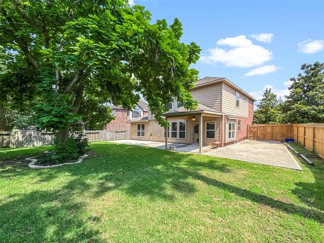 16019 Rustlers Trail Ln, Cypress, TX 77429 - back of house featuring a patio, a ceiling fan, and brick siding