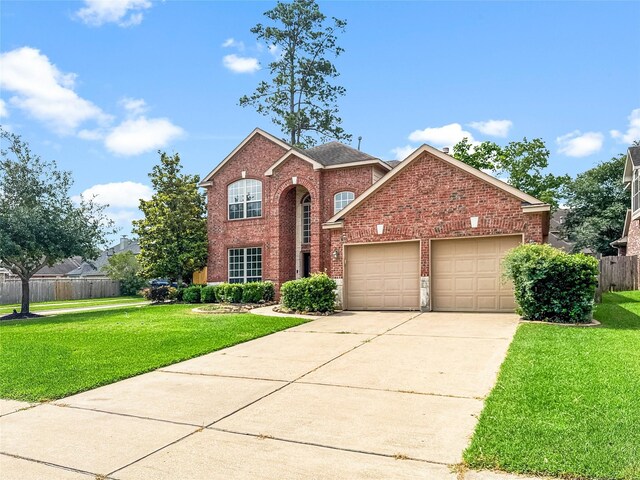 16019 Rustlers Trail Ln, Cypress, TX 77429 - traditional-style house with brick siding, an attached garage, and concrete driveway