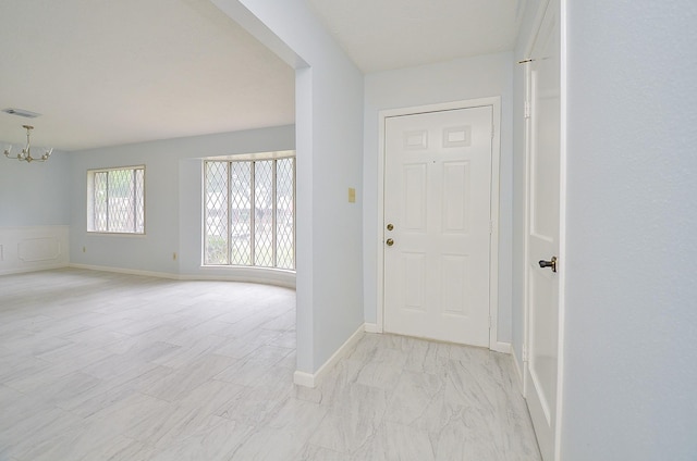 10947 Vanderford Dr, Houston, TX 77099 - foyer entrance featuring a chandelier and baseboards