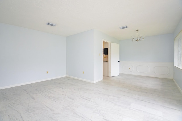 10947 Vanderford Dr, Houston, TX 77099 - unfurnished room with a chandelier