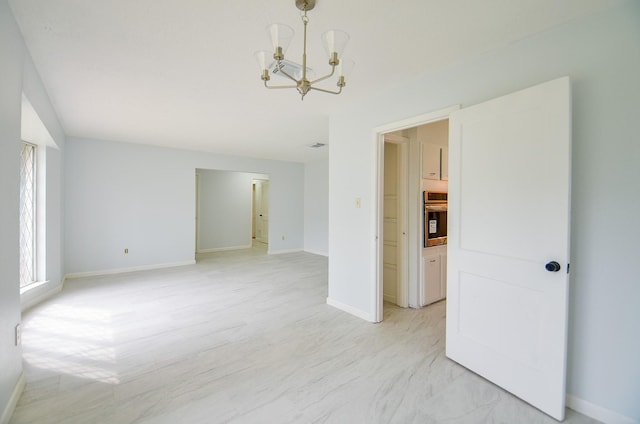10947 Vanderford Dr, Houston, TX 77099 - unfurnished room with a chandelier and baseboards
