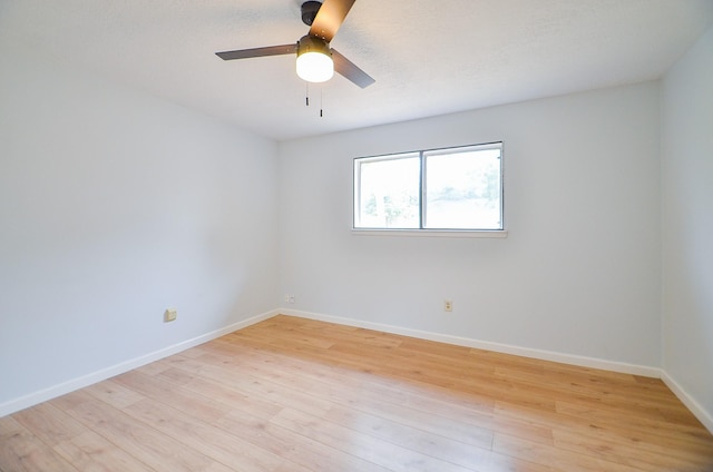 10947 Vanderford Dr, Houston, TX 77099 - empty room with light wood finished floors, baseboards, and a ceiling fan