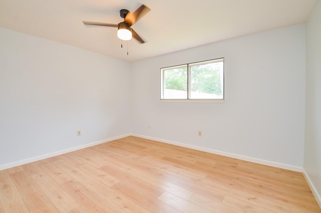 10947 Vanderford Dr, Houston, TX 77099 - unfurnished room with light wood-style flooring, a ceiling fan, and baseboards