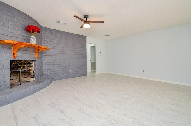 10947 Vanderford Dr, Houston, TX 77099 - living area featuring ceiling fan, a brick fireplace, a textured ceiling, and baseboards