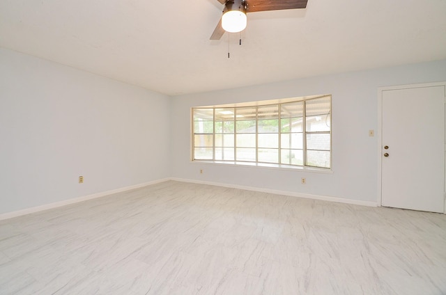 10947 Vanderford Dr, Houston, TX 77099 - spare room featuring a ceiling fan and baseboards