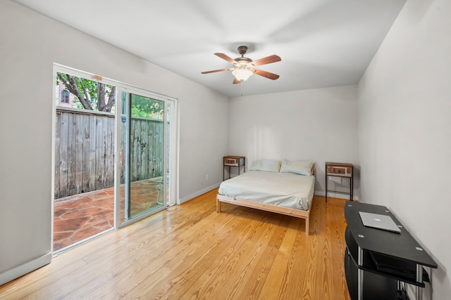939 Colorado St Unit 22, Houston, TX 77007 - bedroom featuring access to outside, light wood-style floors, baseboards, and a ceiling fan