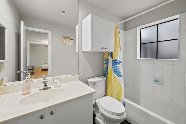 939 Colorado St Unit 22, Houston, TX 77007 - bathroom featuring toilet, vanity, and shower / bath combo with shower curtain