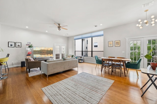 939 Colorado St Unit 22, Houston, TX 77007 - living area with french doors, wood finished floors, recessed lighting, a chandelier, and a ceiling fan