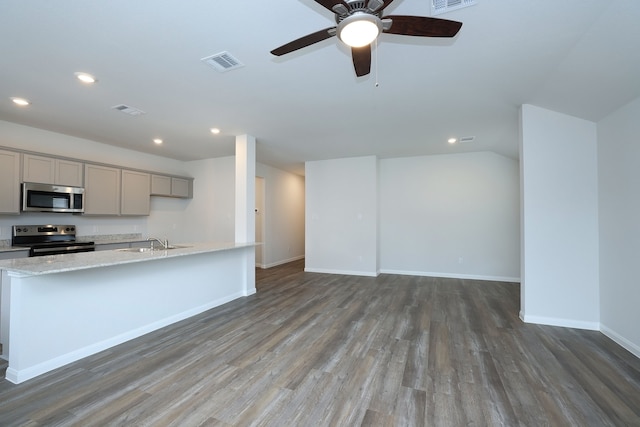 26449 Lakeshore Dr, Hempstead, TX 77445 - kitchen with appliances with stainless steel finishes, gray cabinets, a sink, wood finished floors, and recessed lighting