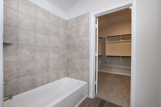 26449 Lakeshore Dr, Hempstead, TX 77445 - full bath with a tub to relax in, wood finished floors, lofted ceiling, a spacious closet, and a shower