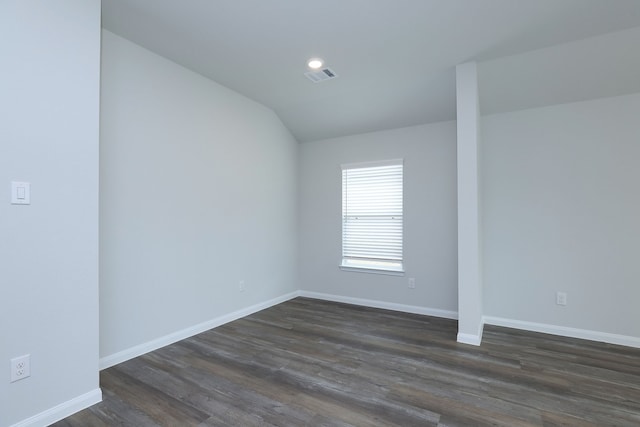 26449 Lakeshore Dr, Hempstead, TX 77445 - spare room with dark wood-type flooring, baseboards, lofted ceiling, and recessed lighting
