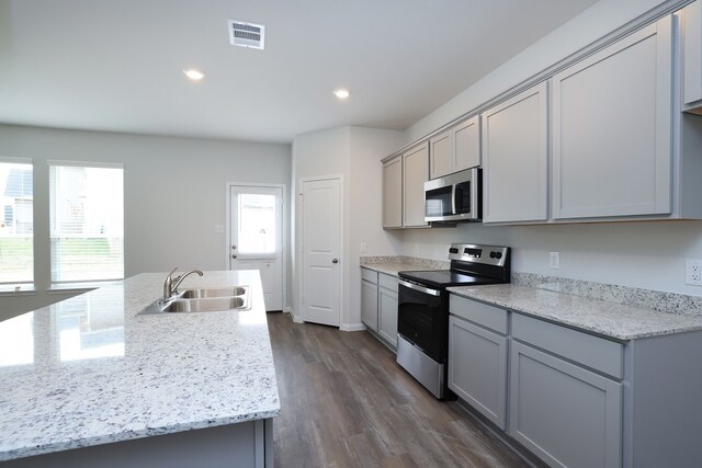 26449 Lakeshore Dr, Hempstead, TX 77445 - kitchen featuring electric range oven, stainless steel microwave, a sink, gray cabinets, and recessed lighting