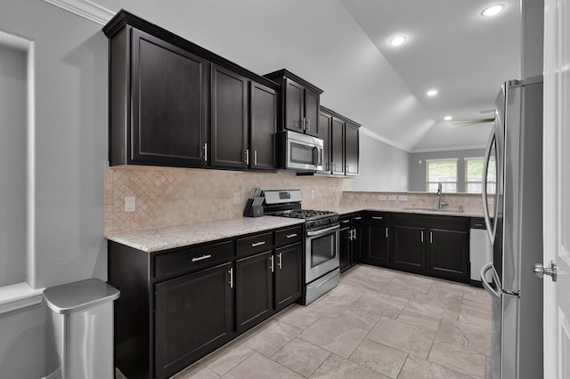 3921 Enchanted Timbers Ln, Spring, TX 77386 - kitchen with appliances with stainless steel finishes, crown molding, a sink, backsplash, and lofted ceiling