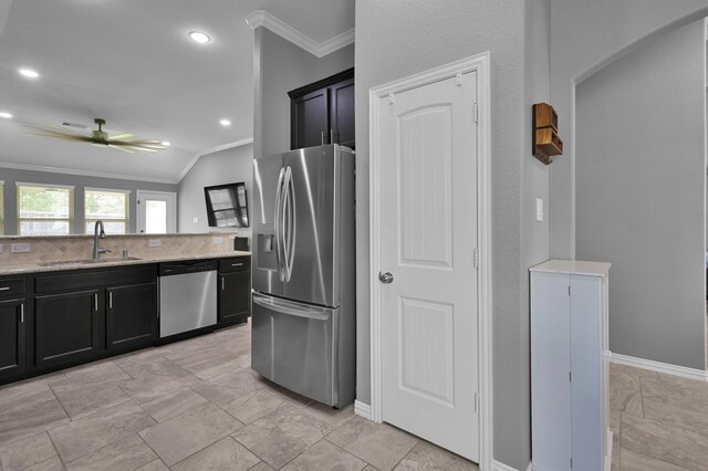 3921 Enchanted Timbers Ln, Spring, TX 77386 - kitchen with stainless steel appliances, a sink, crown molding, light stone counters, and lofted ceiling