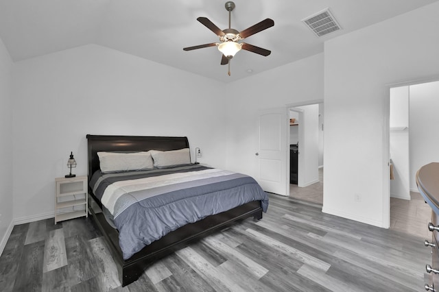 3921 Enchanted Timbers Ln, Spring, TX 77386 - bedroom with wood finished floors, lofted ceiling, baseboards, a ceiling fan, and a spacious closet